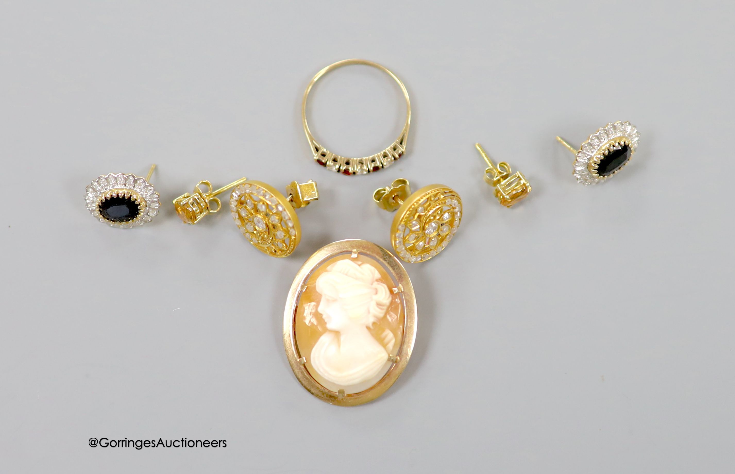A pair of 9ct, sapphire and diamond set oval earrings (no butterflies), a pair of yellow metal and diamond set earrings(adapted), one other pair, a modern 9ct mounted oval cameo shell brooch and a 9ct gold and CZ ring